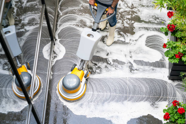 Canguard Maintenance team performing hard surface floor care using Machine floor washing .